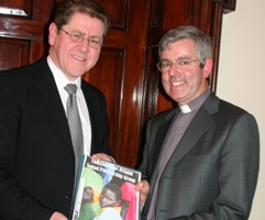Archdeacon Stephen Forde presents Africa Section Director Kevin Dowling with a dossier prepared by the Sudan Partnership Group.