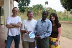 Archdeacon Stephen Forde presents a gift to Bishop Hilary soon after the team arrived in Yei. Looking on are accountant David Cromie and DCO Karen Bushby.