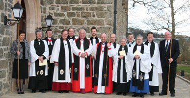 Canon George Graham, Lord Eames and the Bishop of Connor with clergy and select vestry members at the Rehallowing Service at Dunluce Parish Church.