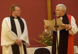 Bishop Harold Millar (right) introduces the Rev Barry Forde as the new chaplain at Queen's. Photo: Andy Boal.
