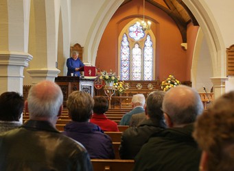 A loyal group of parishioners listen to Canon McReynolds record-breaking sermon. Photo: Cliff Donaldson.