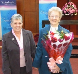Ena Gillespie presented founder member and organist Ella Horner with flowers on behalf of the church during the 40th anniversary celebrations