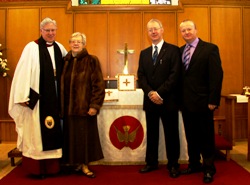 Mrs Mildred Cochrane with her sons Peter and Michael and the Dean of Connor view the new Communion Frontal dedicated in memory of the late Canon Ken Cochrane. 