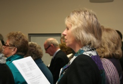 Diocesan Secretary June Butler joins the praise at the Service of Dedication in Whiterock.