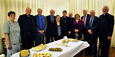 Ready to enjoy supper after her institution is the Rev Louise Stewart with clergy and guests. Photo: Arthur McCartney.
