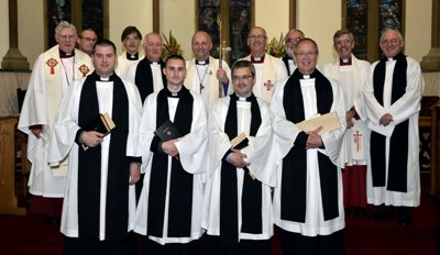 Newly ordained priests Brian Lacey, Peter Ferguson, Trevor Kelly and Brian Howe, pictured with Bishop Alan and clergy who took part in the Service of Ordination in St Patrick’s, Ballymoney, on June 9. Photo by Colin Loughead.