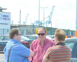 The Rev Adrian Dorrian, the Rev Peter McDowell and Training Co-ordinator Peter Hamill chat while waiting for a boat.