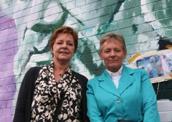 Open Hands community relations officer Marion Weir and the Rev Edith Quirey beside the mural.