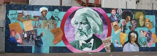 The mural has Frederick Douglass at its centre.