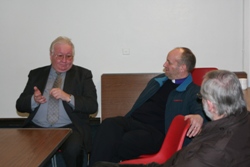The Bishop and Archdeacon Dodds listen intently to Billy MacAuley, principal of Black Mountain Primary School.