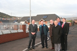 Councillor Frank McCoubrey, Bishop Abernethy, Archdeacon Barry Dodds, Bill Patterson, manager, Greater Shankill Community Council; the Rev John McClure and Winston Irvine, interface community development officer, outside the new social housing at Springmartin.