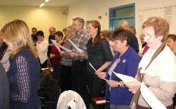 Joining in the singing during the Commissioned Ministers' Quiet Day.