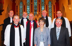 At the institution are: Back Row: William Taggart (Registrar), Barry Dodds (Archdeacon), Canon David McClay (Preacher), Paul Jack (Bishop's Chaplain). Front Row: Gary Millar, Bishop Alan Abernethy, Kate Crothers (People's Churchwarden), George Browne (Rector's Churchwarden)