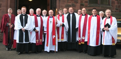 At the Ordination of Priest are, from left: Alan White, Dean’s Verger; the Ven Stephen Ford, Archdeacon of Dalriada; the Rev Barry Forde; Dean John Bond; the Rev Campbell Dixon; the Ven Barry Dodds, Archdeacon of Belfast; the Bishop of Connor; the Rev Clifford Skillen; Canon Will Murphy, Director of Ordinands; the Rev John McClure; the Rev William Taggart, Registrar; the Rev Kenneth Gamble; the Rev Mark Reid; Canon Edgar Turner, Principal Registrar, and the Rev Charles McCollum.