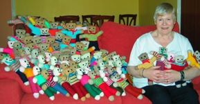 Pearl McCormick with just some of the teddies she has knit for children in Kitwe, Zambia.