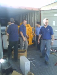 Pictured are members of Hope Builders and Holy Trinity loading the container prior to shipment. 