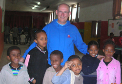Connor Diocese :: News :: The Rev Canon Ernest Harris pictured with some of the children at the Mekelle youth centre.