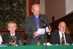 Bishop Alan delivers his address flanked by Judge Derek Rodgers and lay secretary Robert Kay.