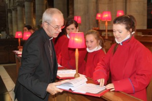 The Archbishop chats to choir girsl in St Anne's Cathedral.