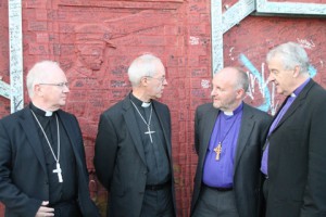 Archbishop Welby at the Peace Wall with the Archbishop of Armagh, the Bishop of Connor and the Archbishop of Dublin.