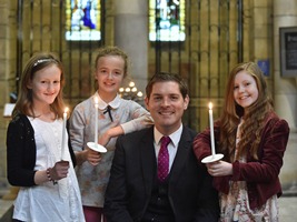 NICHS patron Malachi Cush with members of the Stormont School of Singing.