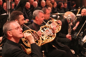 Some of the brass section warm up before the start of the War Requiem in St Anne's.