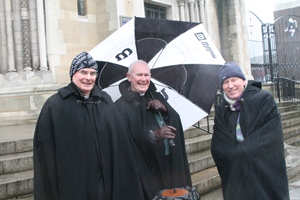 Never mind the rain! Dean Mann on the Cathedral steps with the Rev Canon Ronnie Nesbitt and the Rev Campbell Dixon.