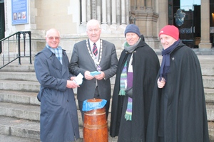 Representatives of the British Deer Society (NI branch) present Dean John Mann and Bishop Alan Abernthy with a cheque for £790 at the start of the 2014 Black Santa Sit-out.