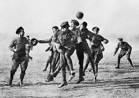 Soldiers playing football in no man's land, 1914.