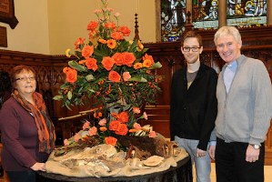 Heather Gibson, event co-ordinator, the Rev Simon Genoe, vicar, and the Rev Canon Sam Wright, rector, admire one of the beautiful floral displays in Lisburn Cathedral.