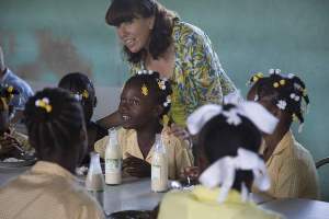 Esther's mum Kathy Childress meets children in Haiti.