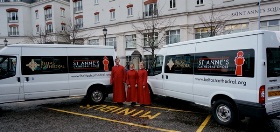 The Cathedral Choir minibuses, as modelled by choristers Hannah, Megan and Master of the Choristers David Stevens.