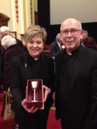 Canon Denise Acheson with the Communion Cup presented to her as a representative of the Church of Ireland by The Very Rev Michael Sheehan, Administrator of St Patrick’s Parish, Donegall Street.