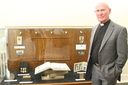 The Rev Campbell Dixon, St Anne's, with the memorial books on loan to the exhibition.