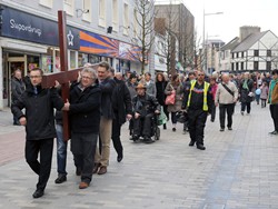 Lisburn city centre ministers pictured leading the ‘Good Friday carrying of the cross walk of witness’ as the procession makes its way along Bow Street to the front of Lisburn Cathedral for a short act of worship. Photo: John Kelly.