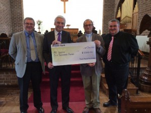 Neil McConnell (People’s Church Warden), Paul Clark (President of the NI Hospice), the Rev. Canon WJ Taggart (Rector) and Stuart McClure (Rector’s Church warden) present the cheque from the Parish of St Katharine.