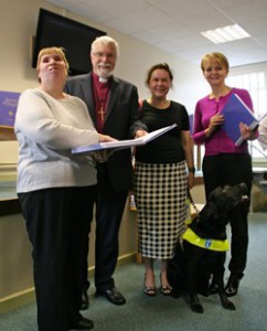Pictured at the presentation (left to right): Margaret Mann, Braille user; the Rt Revd Harold Miller, Chair, Liturgical Advisory Committee; Hazel Flanagan, Braille user, with her guide dog, Kelty; and Sue McAllister, Director-General, Northern Ireland Prison Service.