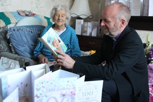The Bishop of Connor reads May’s 100th birthday card from Her Majesty The Queen.