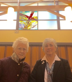 Mrs Olive Eccleston with her daughter Patricia prior to the dedication of the second stained glass window designed by David Esler in St Mark's, Ballymacash.
