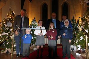 Schoolchildren cut the ribbon to declare the Festival open. The picture includes Mrs Rosemary Frayne, organiser, Mr George Coulter and the rector, the Rev Gary Millar.