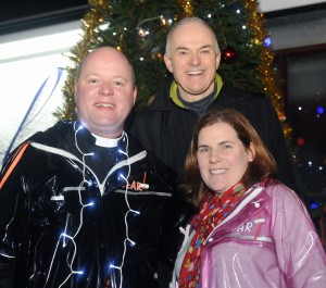 The Rev Adrian McLaughlin (rector of Dunmurry Parish) pictured with his wife Christine and local television and radio presenter Frank Mitchell (UTV & U105).
