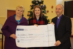 St Mary’s Parish presents a cheque for £2,550 to the Northern Ireland Hospice. 