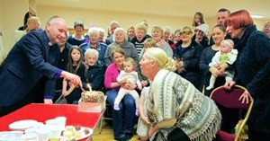 Mandy Pyper blows out the fifth birthday candle after the anniversary service in Whiterock.