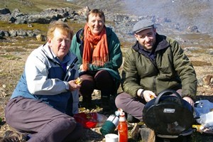 The Rev Mike McCann, Sarah McCann and Bishop Darren McCartney enjoy a riverbank picnic in the Canadian Arctic.