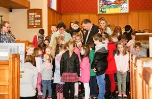 The St Paul's Sunday School prays for Canon and Mrs Carson who will soon be leaving the parish. Picture: RnBphotographyni