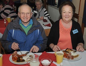 Sidney and Thelma Campbell pictured tucking into a low calorie fry-up at a community event and fundraiser at Derryvolgie Parish Church.