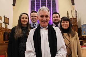 The new Dean of Connor, the Very Rev Sam Wright , with his son Peter and daughter-in-law Vicky, his wife Paula and his son Michael. The Dean's daughter Naomi was unable to attend the service as she is expecting a baby in May.