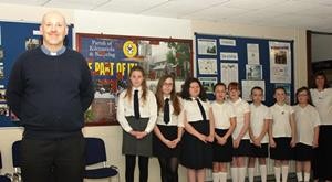 Curate the Rev Iain Jameson with some the girls as they prepare for the start of the display