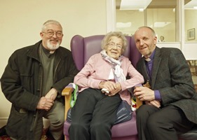 Canon John Budd and Bishop Alan Abernethy with Norah Wright on her 100th birthday.