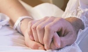 holding hands in hospital